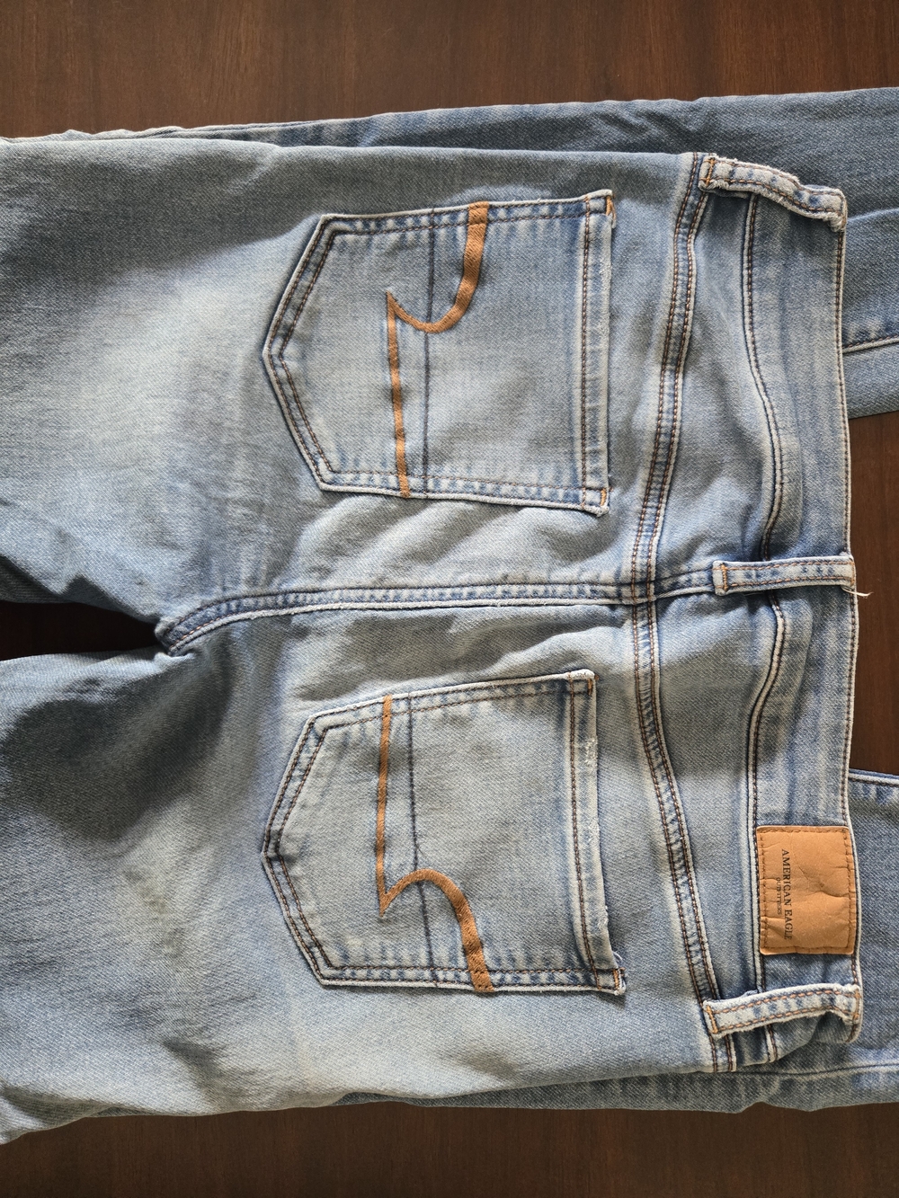 American Eagle Outfitters Light Blue Straight Leg Jeans with Orange Stitching